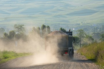Fototapeta na wymiar dump truck on a dusty road