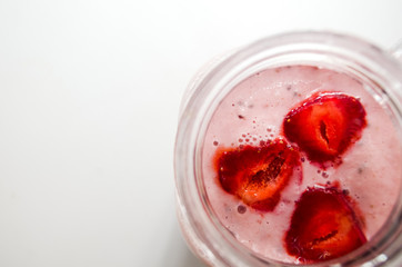 Delicious strawberry smoothie. Healthy Blended Yogurt Decorated with Fruit on white background