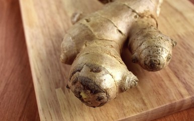 ginger root on a wooden cutting board