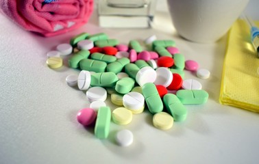 scattering of multi-colored tablets on a light surface