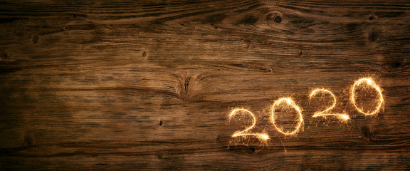 New year 2020 firework on wooden background
