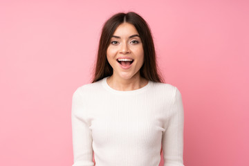 Young woman over isolated pink background with surprise facial expression