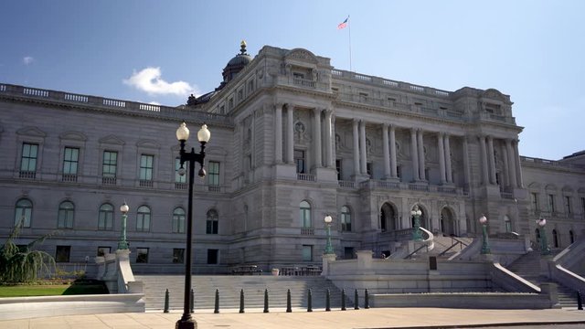 Closeup of front of the Library of Congress Jefferson building in autumn with blue sky in Washington, DC.