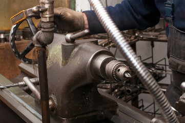 Metal processing by lathe machine. cutting tool at mechanical turning metal working