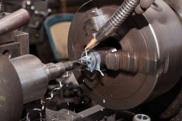 Metal processing by lathe machine. cutting tool at mechanical turning metal working