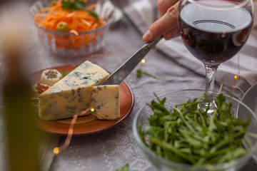 Close up of cutting cheese.
