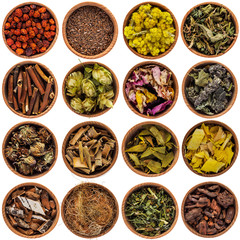 Different dry herbs in wooden cups. Medicinal herbs on a white background
