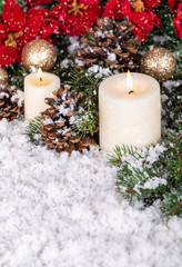 Snowy Scene With Candles and Holiday Decor