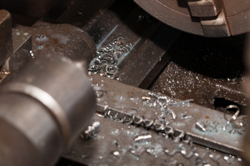 Metal processing by lathe machine. cutting tool at mechanical turning metal working