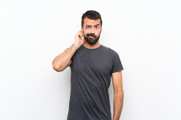 Young handsome man over isolated white background having doubts