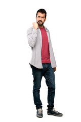 Fototapeta premium Full-length shot of Handsome man with beard with angry gesture over isolated white background