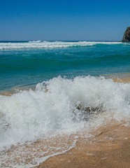 waves crashing on the beach