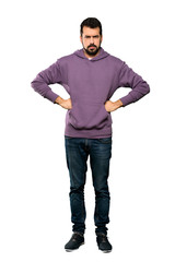 Fototapeta premium Full-length shot of Handsome man with sweatshirt angry over isolated white background