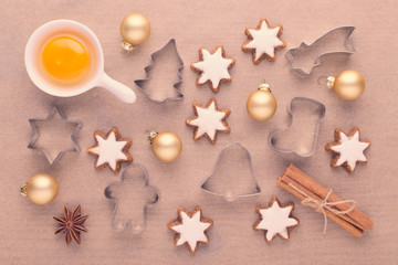 Fototapeta na wymiar ingredients with kitchen tools for dessert baking and star cookies on baking paper