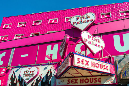 HAMBURG, GERMANY - JULY 24, 2018 : red-light district brothels and strip clubs at the Reeperbahn in Hamburg, Germany.