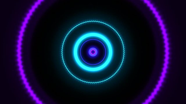 Neon colored circle shapes coming towards the viewer.