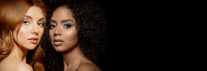 Multi-ethnic beauty. Caucasian and African. Different ethnicity women on black background. Beautiful vogue girls.