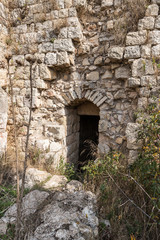 Fototapeta na wymiar Side exit from the main hall in ruins of crusader Fortress Chateau Neuf - Metsudat Hunin is located at the entrance to the Israeli Margaliot village in the Upper Galilee in northern Israel