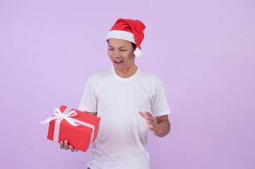 Happy Asian man is a shopping in Christmas day .