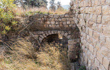 Fototapeta na wymiar The ruins of crusader Fortress Chateau Neuf - Metsudat Hunin is located at the entrance to the Israeli Margaliot village in the Upper Galilee in northern Israel