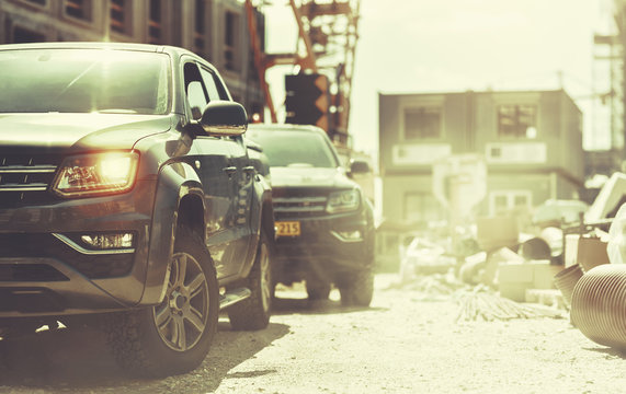 Working Pickup Truck On Construction Site Of New Residential Building