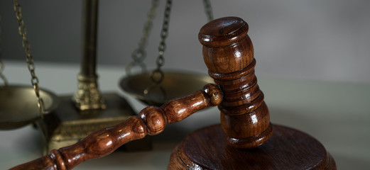 Judge mallet with law books and scales of justice. concept of justice, legal, jurisprudence. 