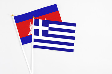 Greece and Cambodia stick flags on white background. High quality fabric, miniature national flag....