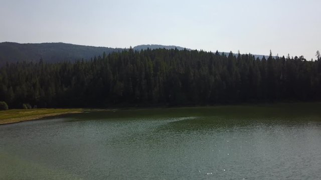 flyng over the lake. track up. maneuver. aerial(drone) footage. v08_00407(DJI_0001_2)