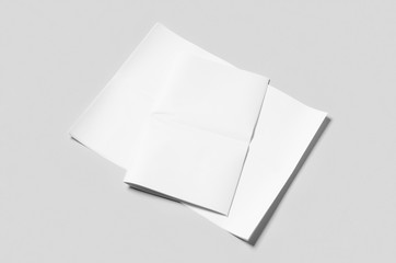Blank newspaper mockup on a grey backgound.