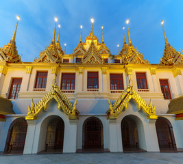 Beautiful Loha Prasat or iron monastery of Wat Ratchanatdaram in twilight , Bangkok, Thailand