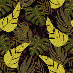 Trend tropical seamless background with bright yellow and green plants and leaves on black background. Seamless pattern with colorful leaves and plants. Beautiful print with hand drawn exotic plants.