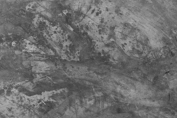 Grunge rough background. Rusted peeled black stone. Abstract fragment wall texture. surface of the gray concrete.
