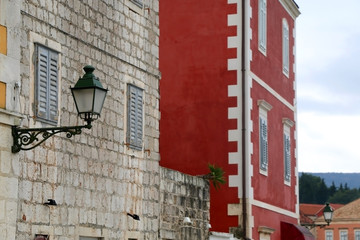 Retro lamp on a traditional colorful Mediterranean building in Stari Grad, on island Hvar, Croatia.