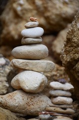 Fototapeta na wymiar many round stones stacked in balance