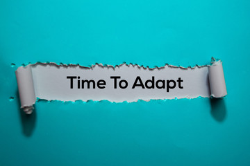 Time To Adapt Text written in torn paper