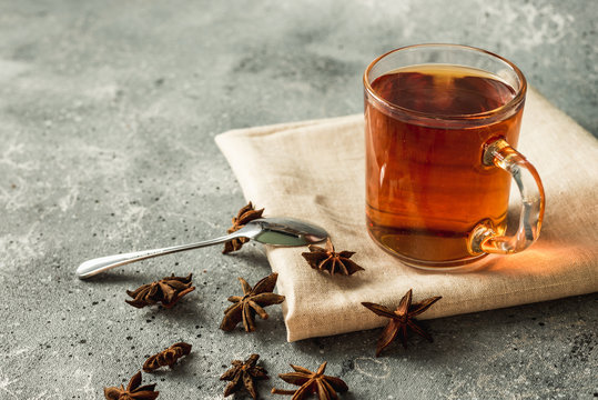 cup of black tea with cinnamon and star anise