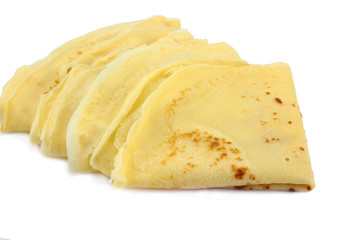 several french pancakes on a white background