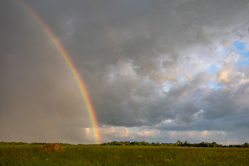 Rainbow on a blue sky on a beautiful summer day