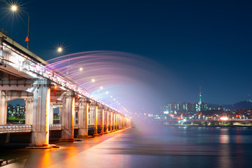night and city scape travel and photography activity from banpo bridge is beautiful  architecture and design during show fountain moving to people and traveler with reflection in river background