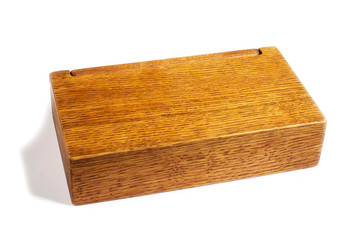 Closed wooden box on a white background. Gift box.