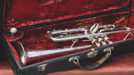 Silver trumpet in a red case