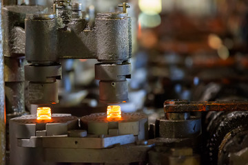 Glassworks. Glass industry. Machine conveyor for the manufacture of glass bottles.