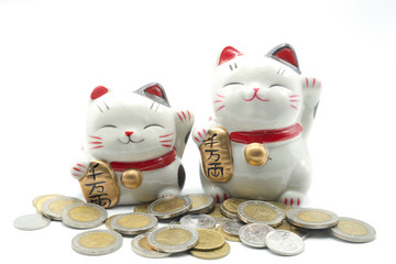 ceramic lucky cat statue for Japanese isolated on a white background, Holds a gold medal in Japanese that translates into prosperity and good fortune.