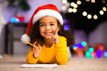Cute african girl has great thought about Christmas gift