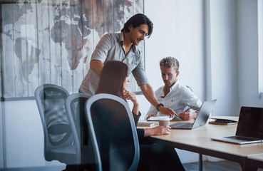 Fototapeta premium Young business people in formal clothes working in the office