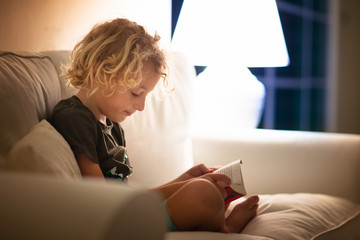 Child reading book. Kids read books.