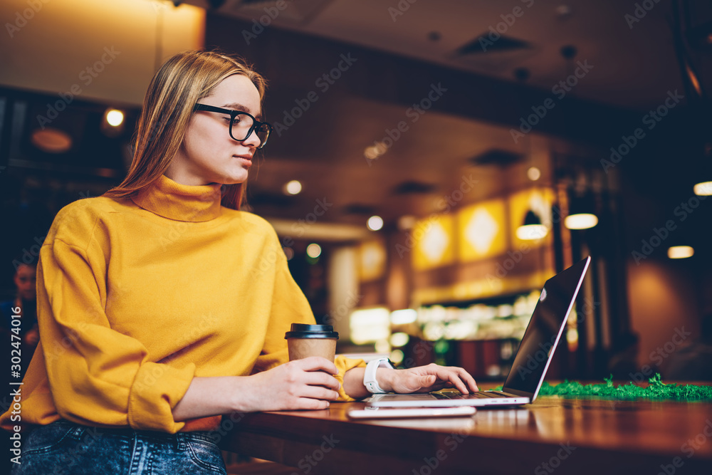 Poster attractive female copywriter typing article for content website on internet space using laptop compu