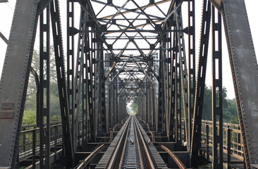 Railroad tracks,old railway bridge vintage,railway bridge on river at Lampang thailand.