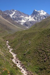 El Morado Natural Monument. A beautiful park located in Caj&oacute;n Del Maipo, Andes mountain range, Chile. mountain and river among the grass