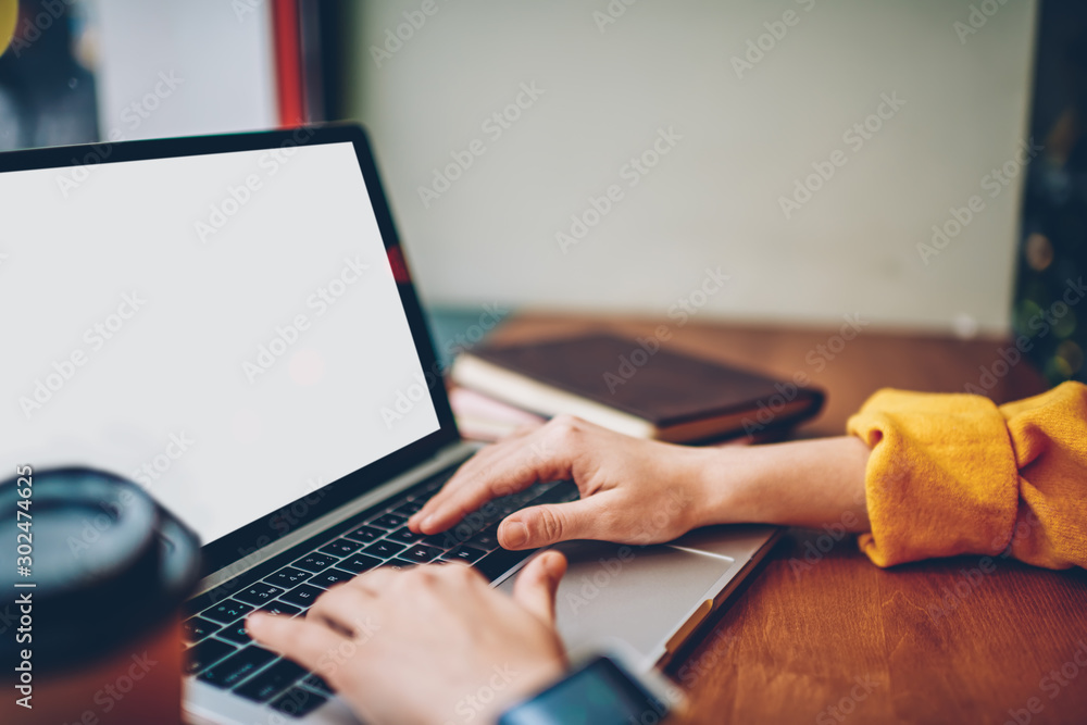 Poster cropped image of female hands typing text on internet web page for updating application on laptop de
